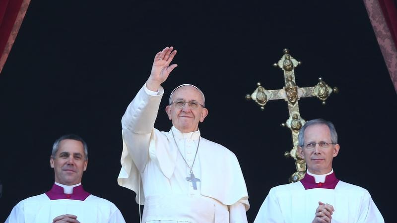 Pope Francis waves from his balcony