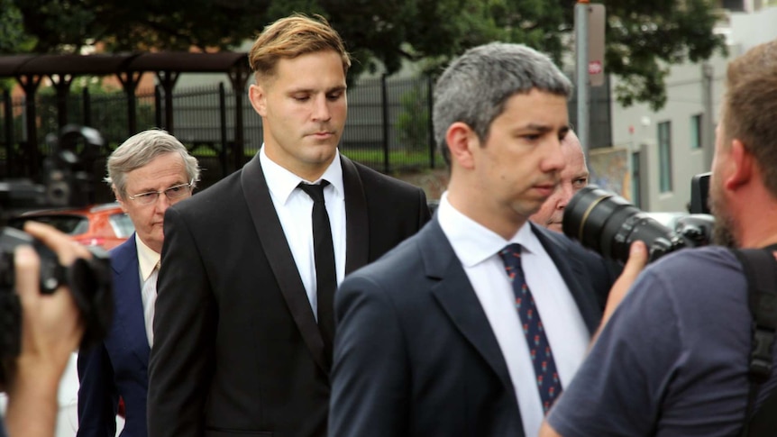 Three men wearing suits.