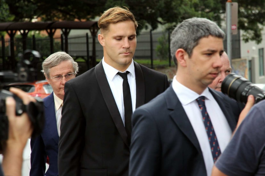 Three men wearing suits.