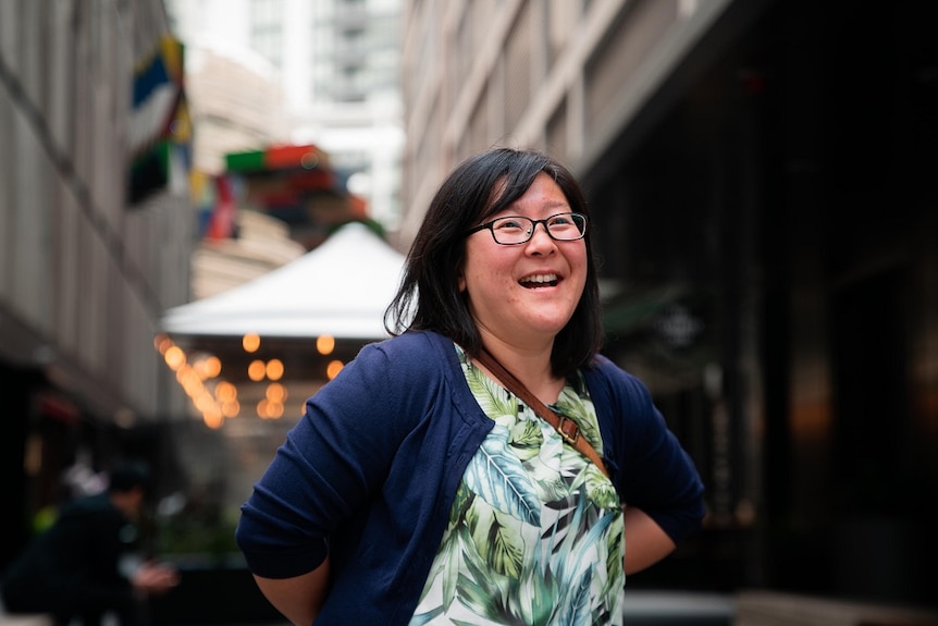 Yoke Yen Lee laughs on a street in Sydney.