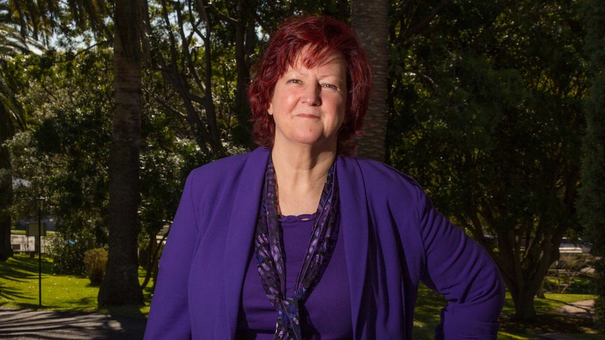 Domestic violence victim Pam Steele stands outside.