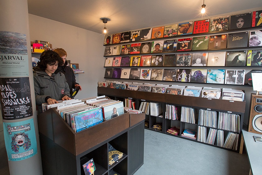 Two men flip through records at the Reykjavík Record Shop
