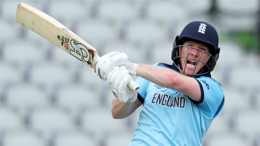 Eoin Morgan opens his mouth in a grimace as he swivels while playing a shot into the leg side