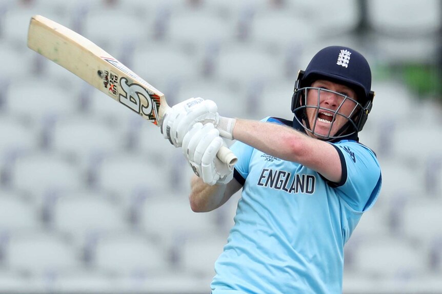 Eoin Morgan opens his mouth in a grimace as he swivels while playing a shot into the leg side