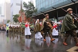 People march in wet conditions in Perth