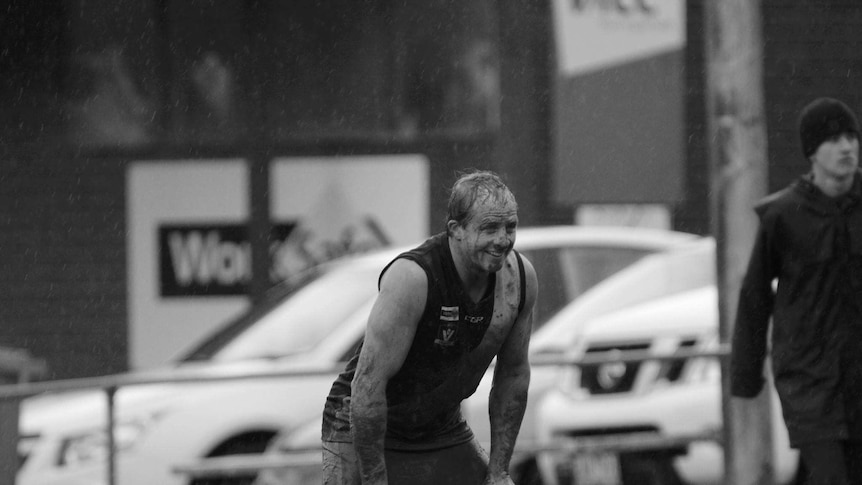 Mirboo North footballer Matt Holland finds something to smile about during a freezing game of football.