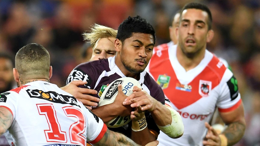 Brisbane Broncos' Anthony Milford runs at the Dragons defence