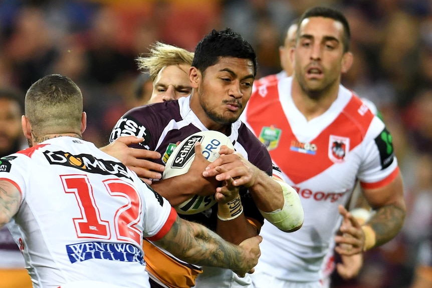 Brisbane Broncos' Anthony Milford runs at the Dragons defence