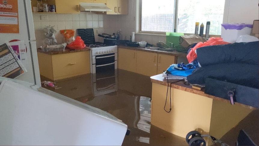Flood water in a kitchen in a home in Fitzroy Crossing