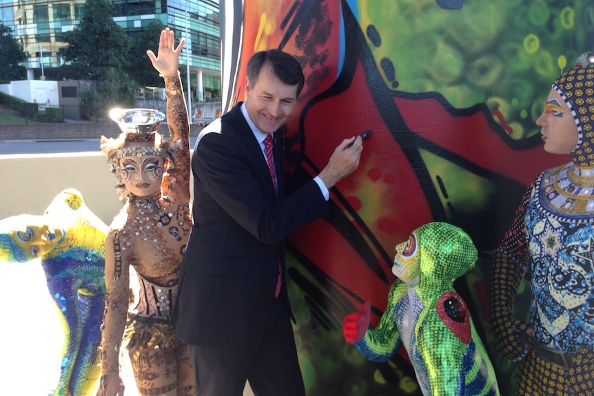 Graham Quirk adds a splash of paint to a street art project