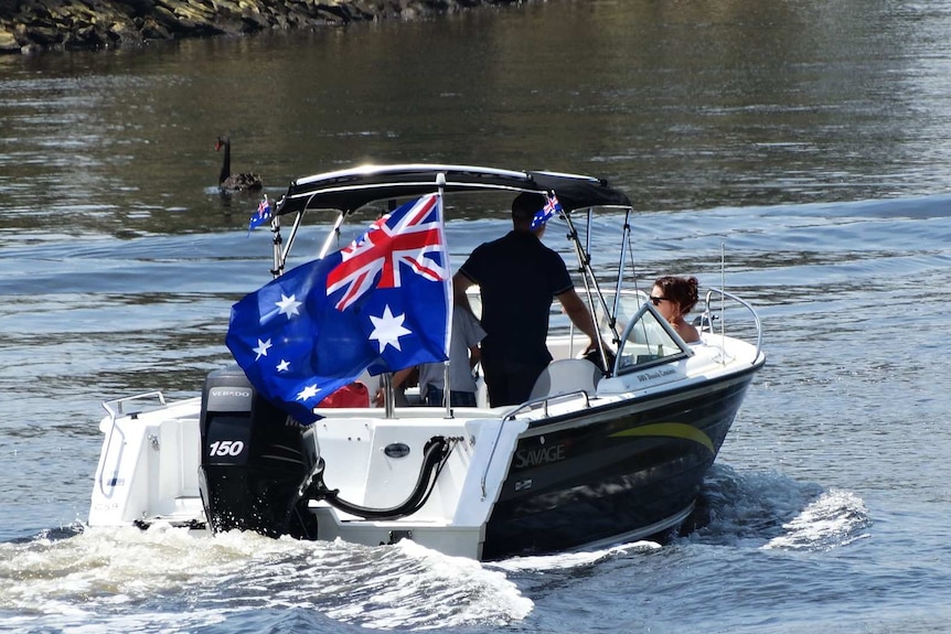 People travelling in a boat on Melbourne's Yarra River on Australia Day.