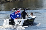 People travelling in a boat on Melbourne's Yarra River on Australia Day.