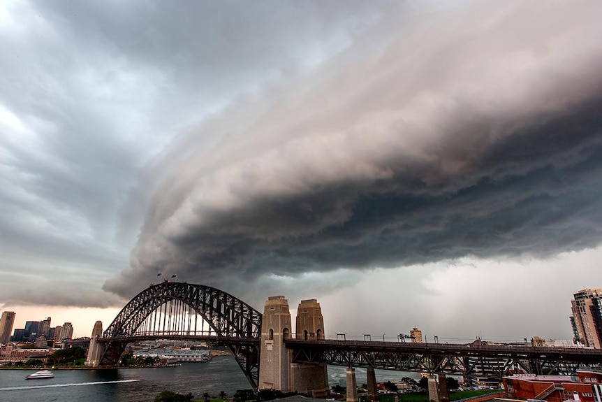 A storm cloud moves across the Sydney Harbour Bridge.