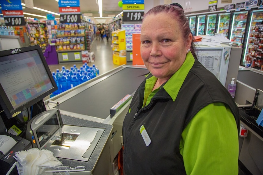 Sue Mortimer working in a supermarket.