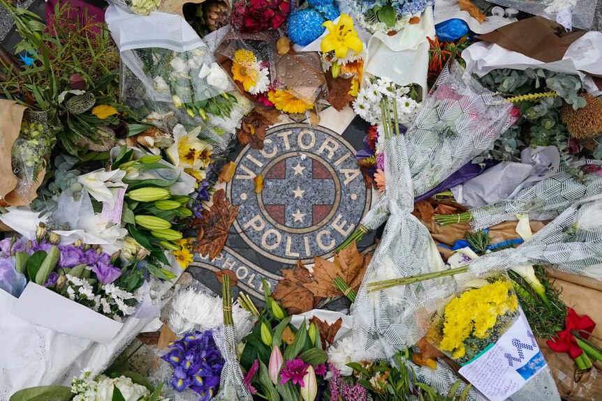 Floral tributes left at the gates of the Victorian Police Academy.
