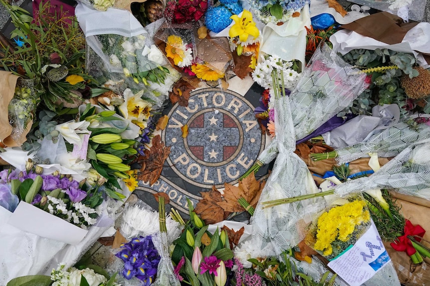 Floral tributes left at the gates of the Victorian Police Academy.