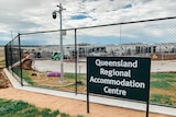 A sign reads "Queensland regional accomodation centre"