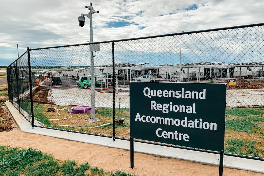 A sign reads "Queensland regional accomodation centre"