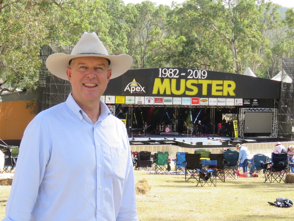 Tony Perrett standing in front of the muster stage.