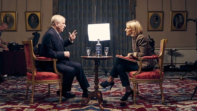 Prince Andrew sits on a chair opposite Emily Maitlis with a film crew in the background.