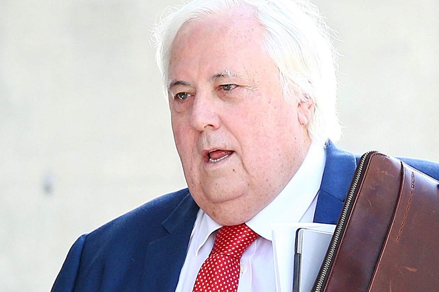 Businessman Clive Palmer arrives at the District Court in Brisbane on July 25, 2019.