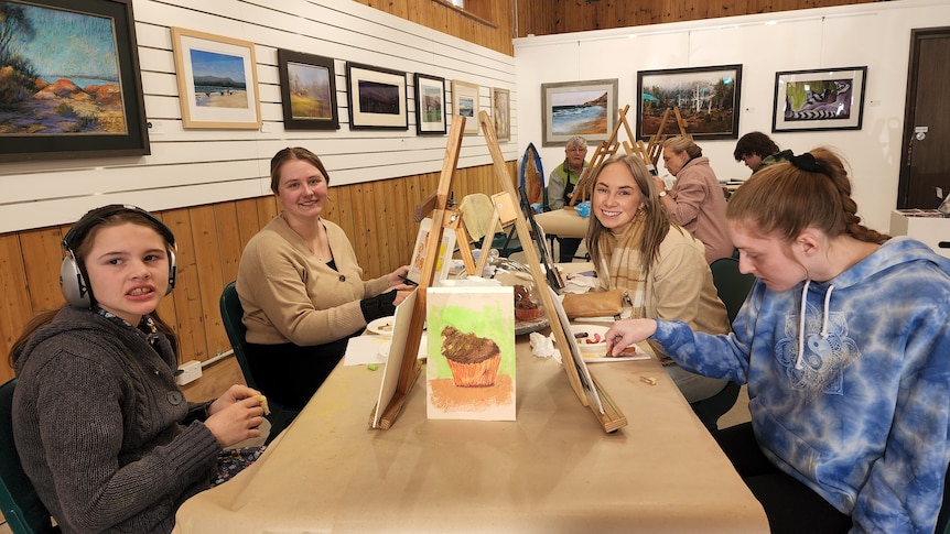 A group of young girls painting