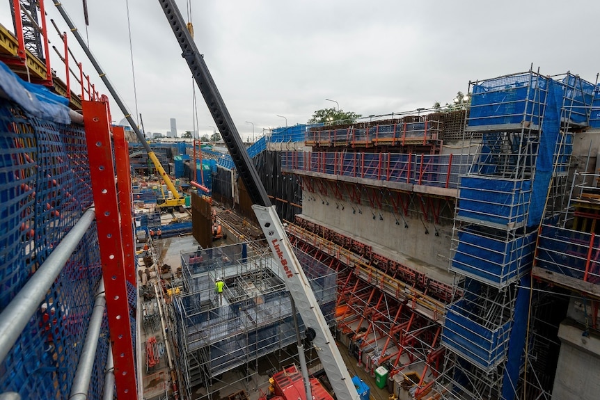 scaffolding and cranes fill a construction site