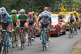Mikel Landa (2R) brings yellow jersey Chris Froome back on stage 15 of the Tour de France.
