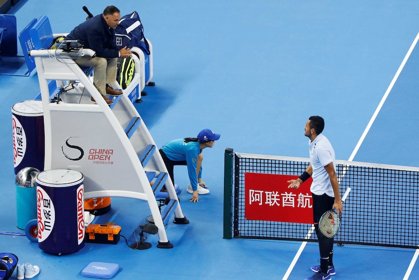 Nick Kyrgios talks to the chair umpire