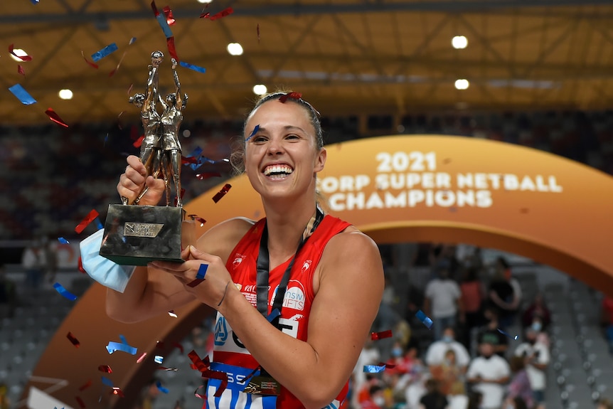 Paige Hadley poses with the winners trophy.