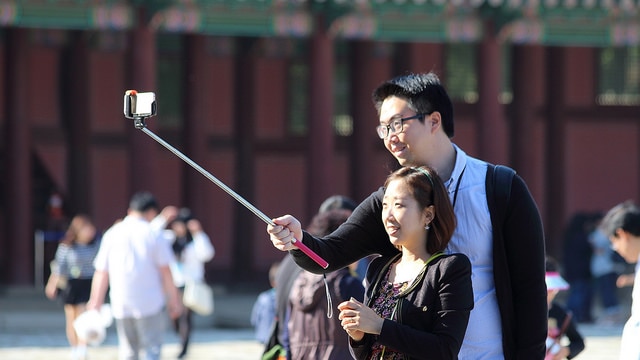 Couple takes selfie with selfie stick