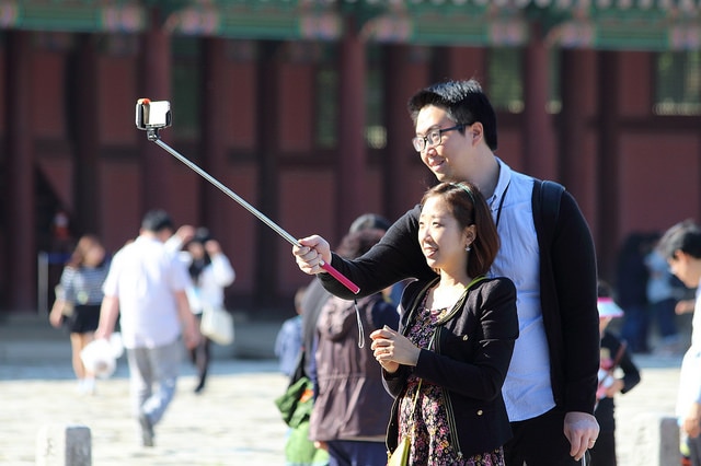 Couple takes selfie with selfie stick