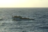 An overcrowded fishing boat, with no shelter for the asylum seekers on board, languishes in the Indian Ocean