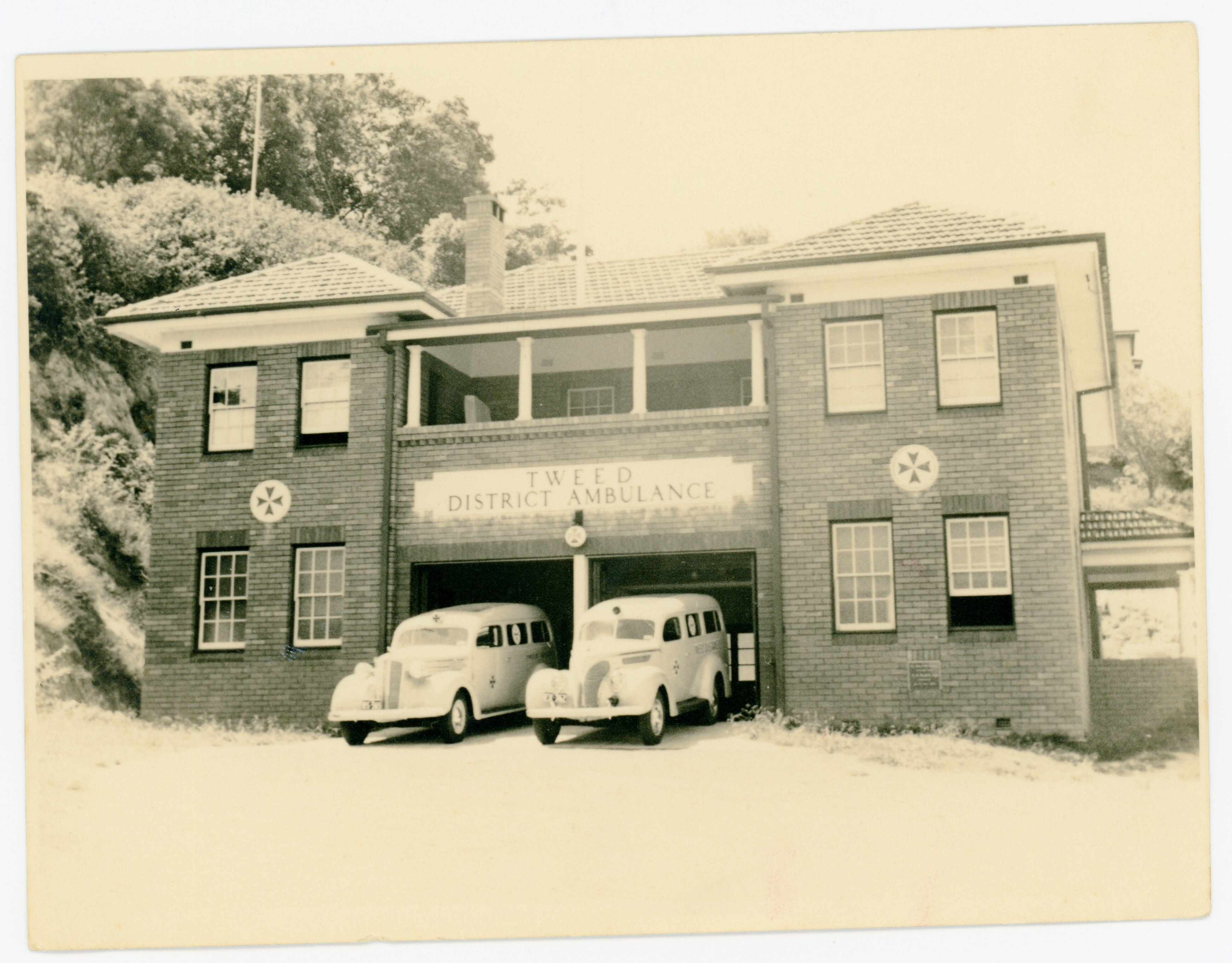 Two ambulances stand in the garage of the Tweed Ambulance Station