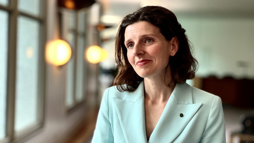 Independent MP for Wentworth Allegra Spender stands in the corridors of Parliament House