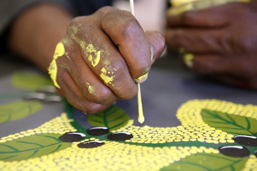 Painting at Ngurratjuta Iltja Ntjarra Many Hands Art Centre