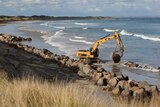 Boulders being lifted into place at Port Fairy beach