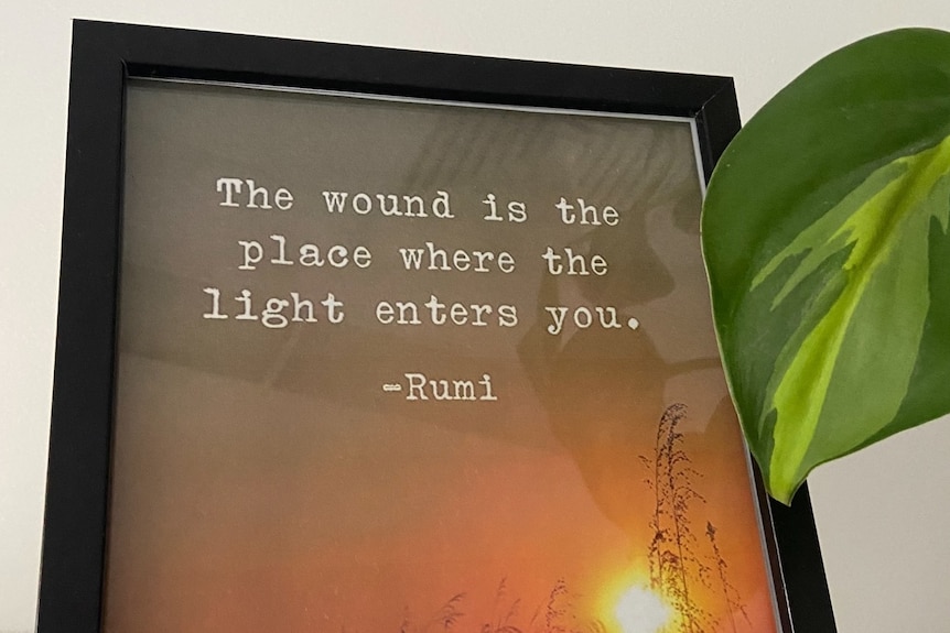 A sign reading The wound is the place where the light enters you, Rumi