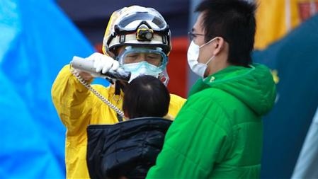 Radiation check near Fukushima nuclear plant (AP)