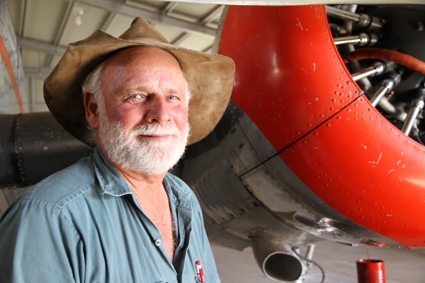 Ross Smith stands next to restored plane in Rolleston workshop, April 2016.