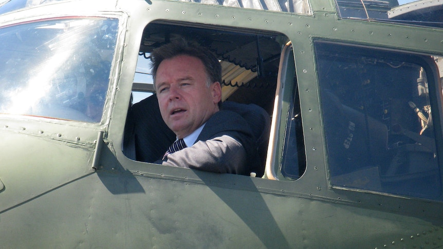 Defence Minister Joel Fitzgibbon at the Point Cook RAAF base with Defence Force personnel