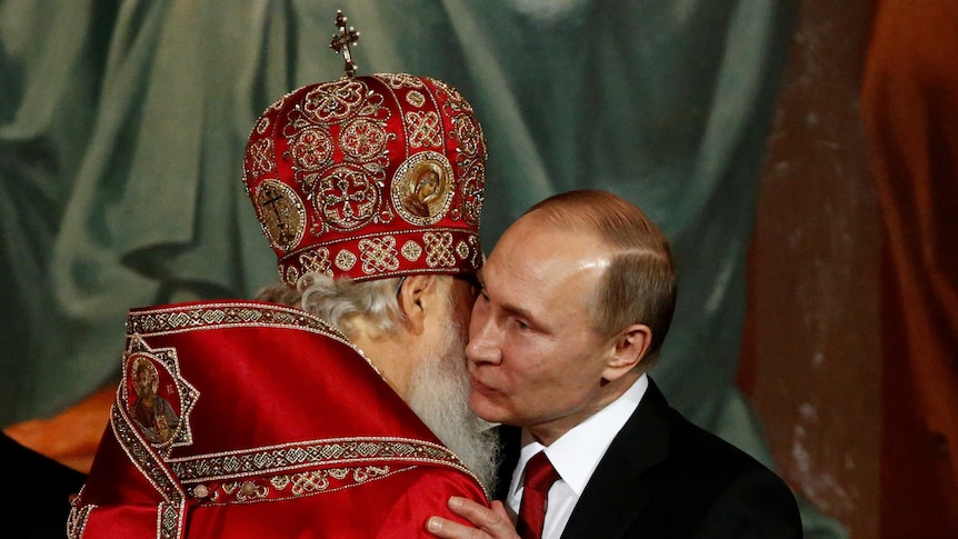Patriarch Kirill, the head of the Russian Orthodox Church, embraces Russian President Vladimir Putin during the Easter service.