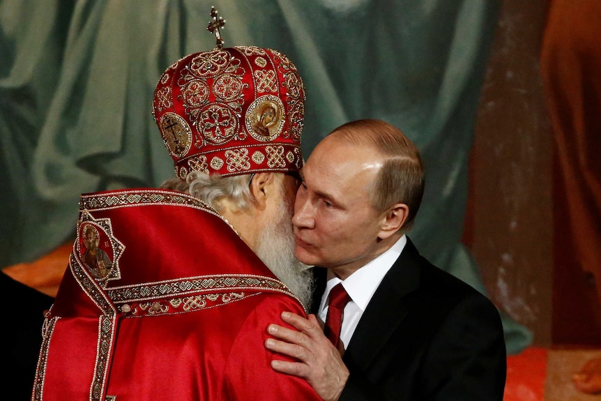 Patriarch Kirill, the head of the Russian Orthodox Church, embraces Russian President Vladimir Putin during the Easter service.