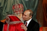 Patriarch Kirill, the head of the Russian Orthodox Church, embraces Russian President Vladimir Putin during the Easter service.