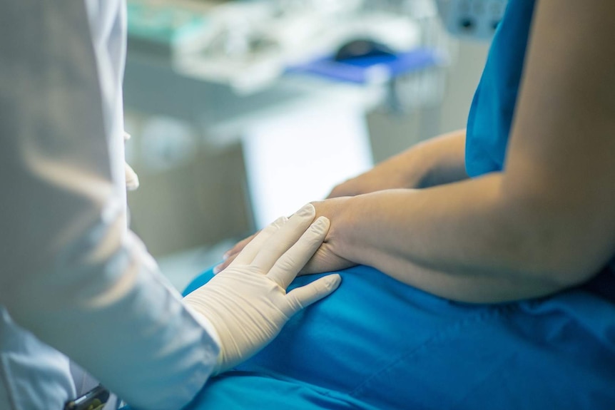 Medical consultation between patient and practitioner.