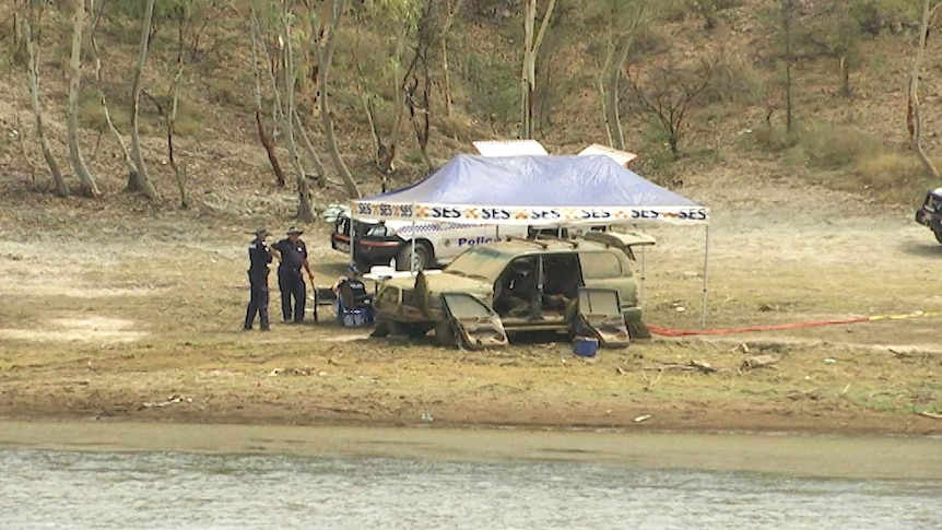 Police examine four-wheel-drive vehicle found submerged at Lake Moondarra near Mount Isa