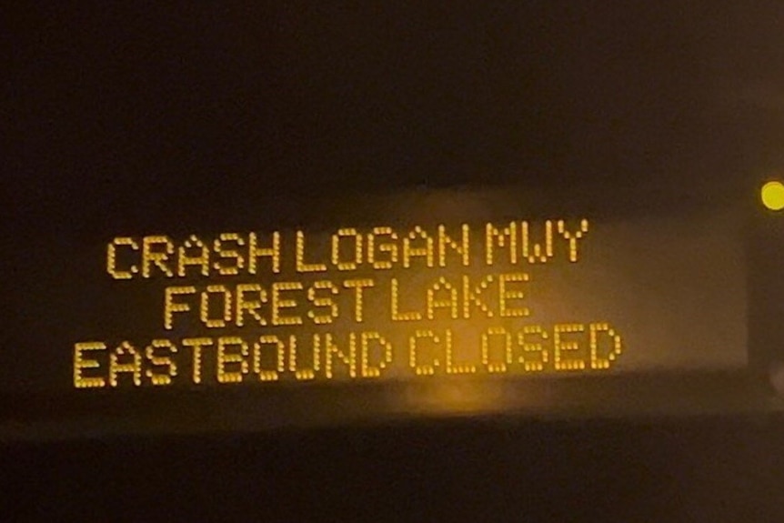 A traffic sign saying 'crash Logan Motorway'.