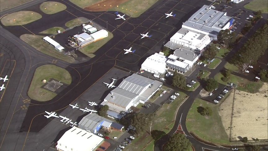 An aerial photo of Jandakot Airport with planes parked on the tarmac.