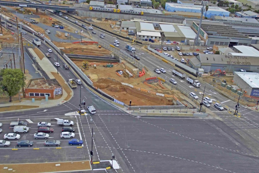 Overhead view of road traffic and roadworks.