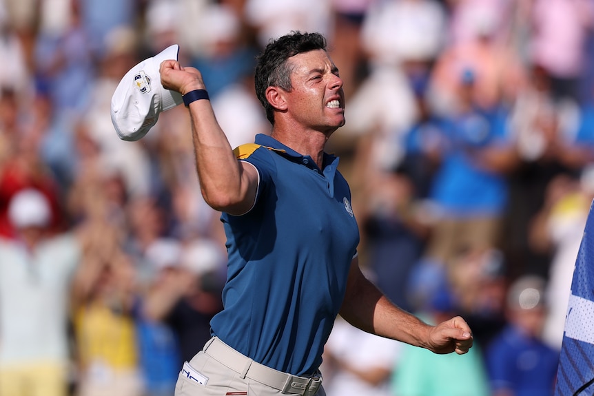 Rory McIlroy throws his hat and grimaces